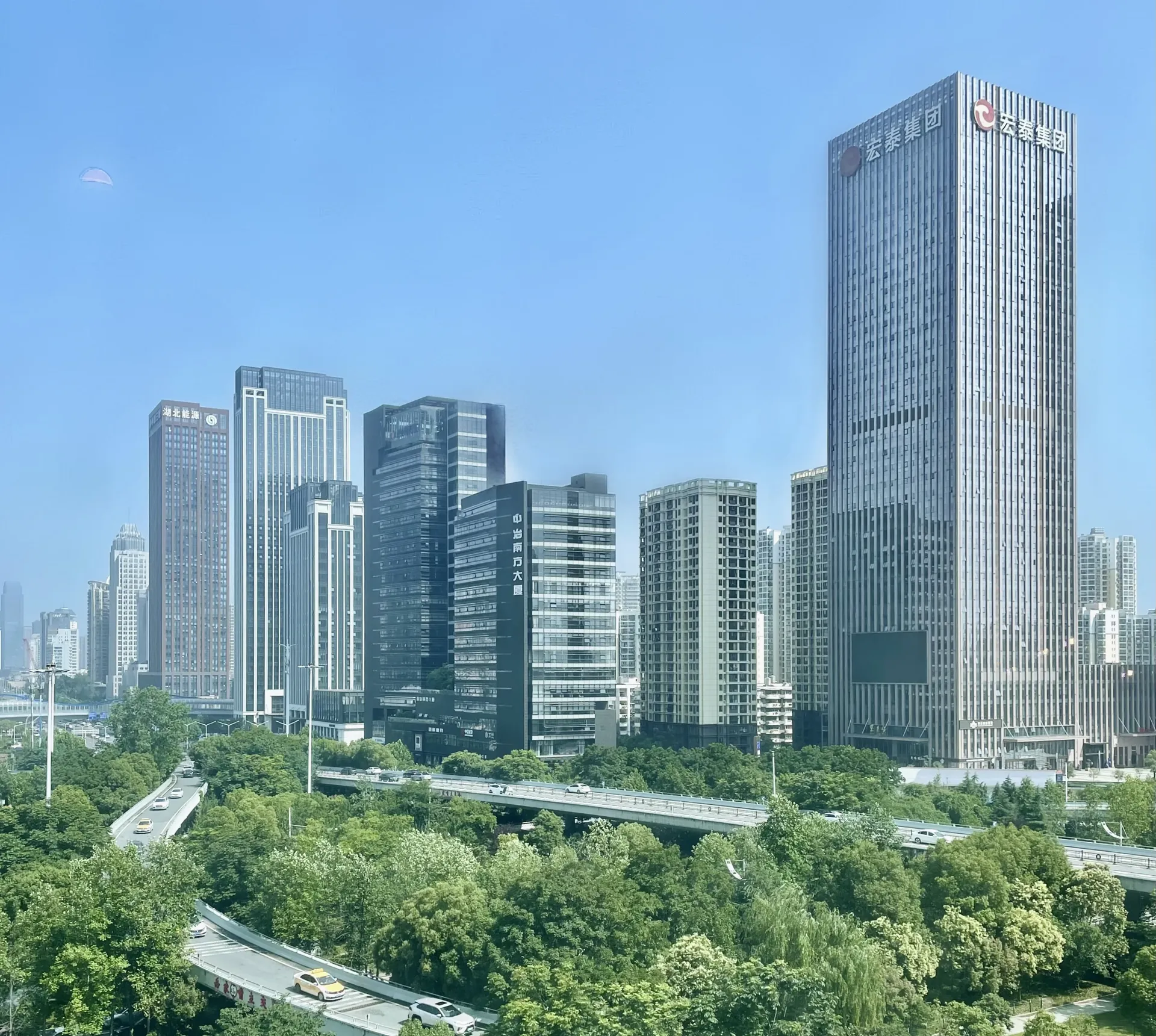 Office buildings, roads and green space at Yuejiazui, Wuhan, photographed in 2023.